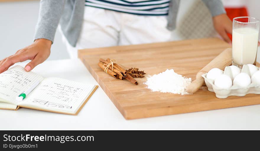 Woman is making cakes in the kitchen