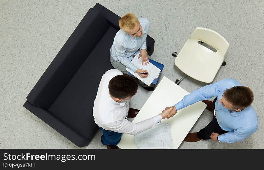 Business people sitting and discussing at business meeting, in office