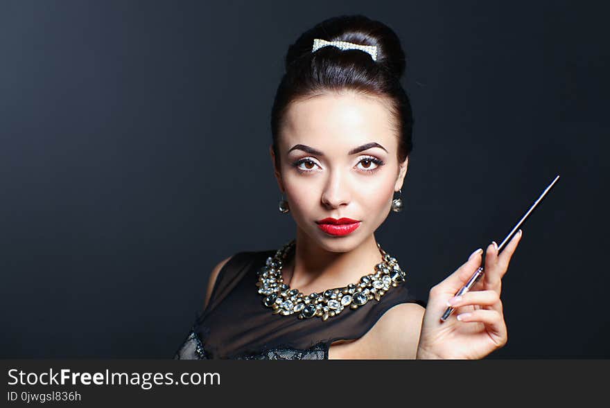 Portrait of young beautiful woman with jewelry