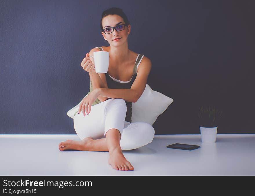 Attractive Caucasian Girl Sitting On Floor