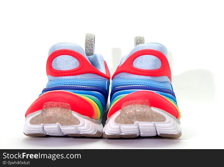 Colourful running shoes on white background,front view ,on floor, clear