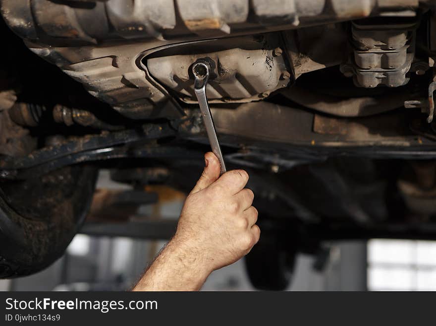 Mechanic Working On A Diesel Filter, Close Up