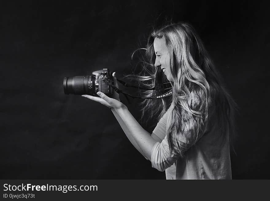 Grayscale Photo of Woman Using Dslr Camera