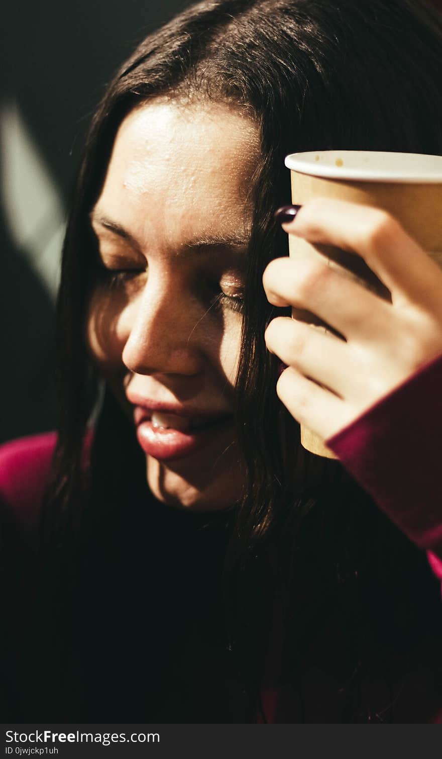 Woman Wearing Red Long-sleeved Shirt Holding Cup