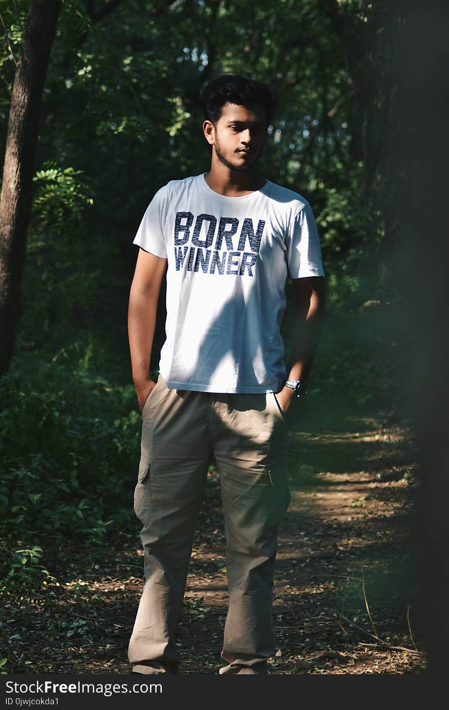 Man Wearing White Shirt and Brown Cargo Pants