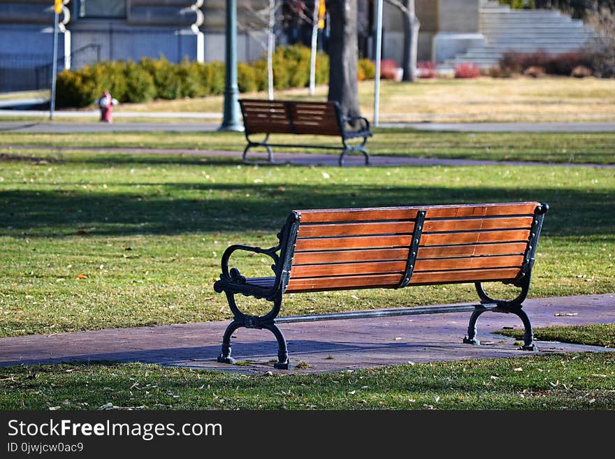 Black and Brown Bench Near Grass Field