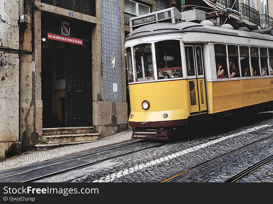 White and Yellow Train With Passenger