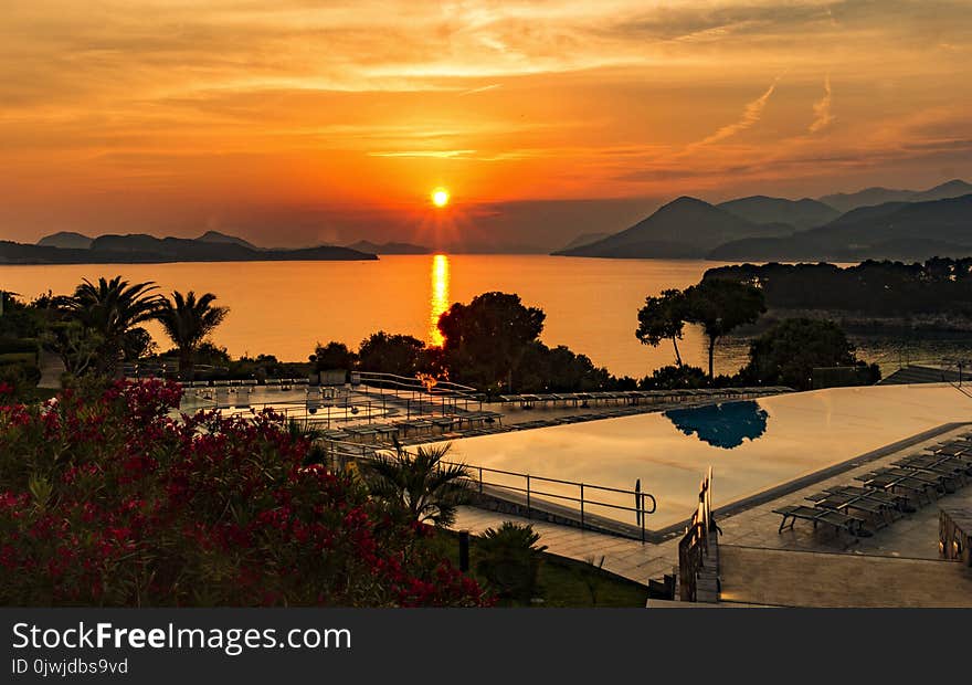 Aerial Photography of Swimming Pool during Sunset