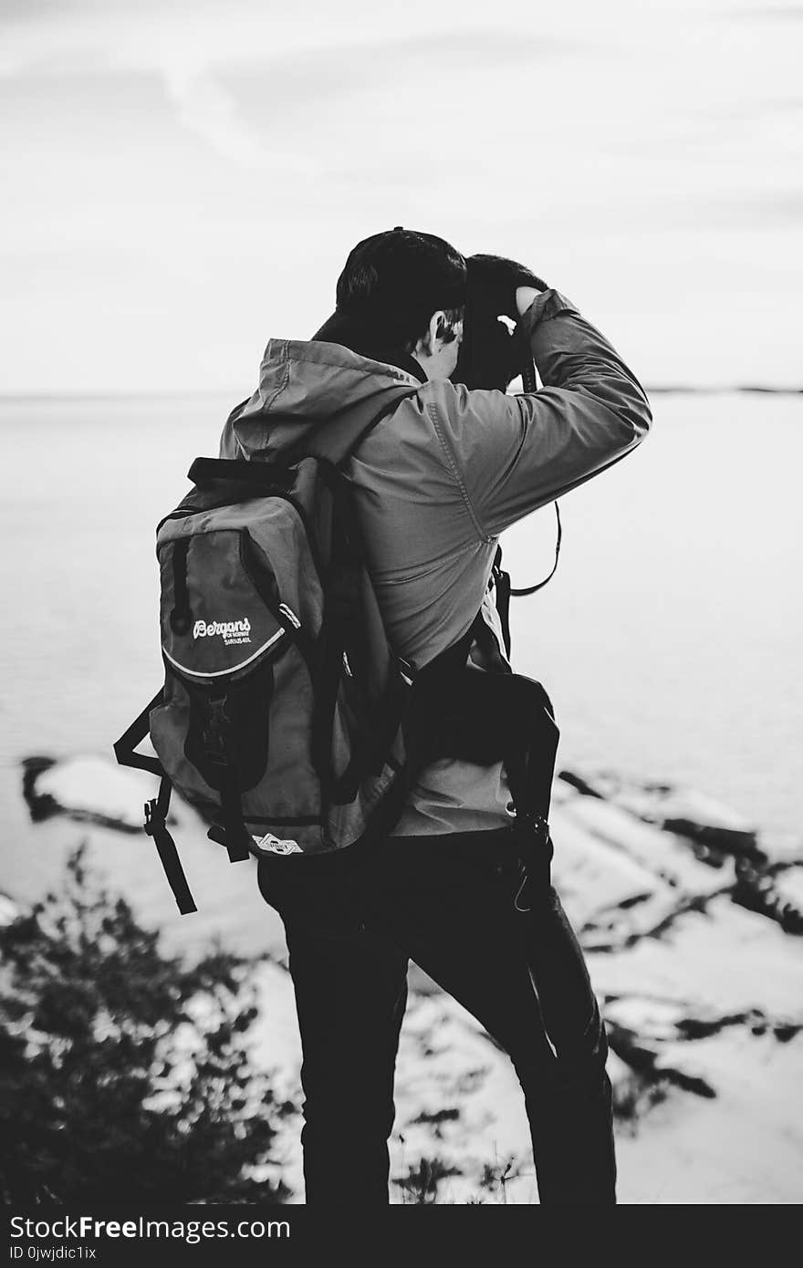 Grayscale Photography of Man Taking Photo