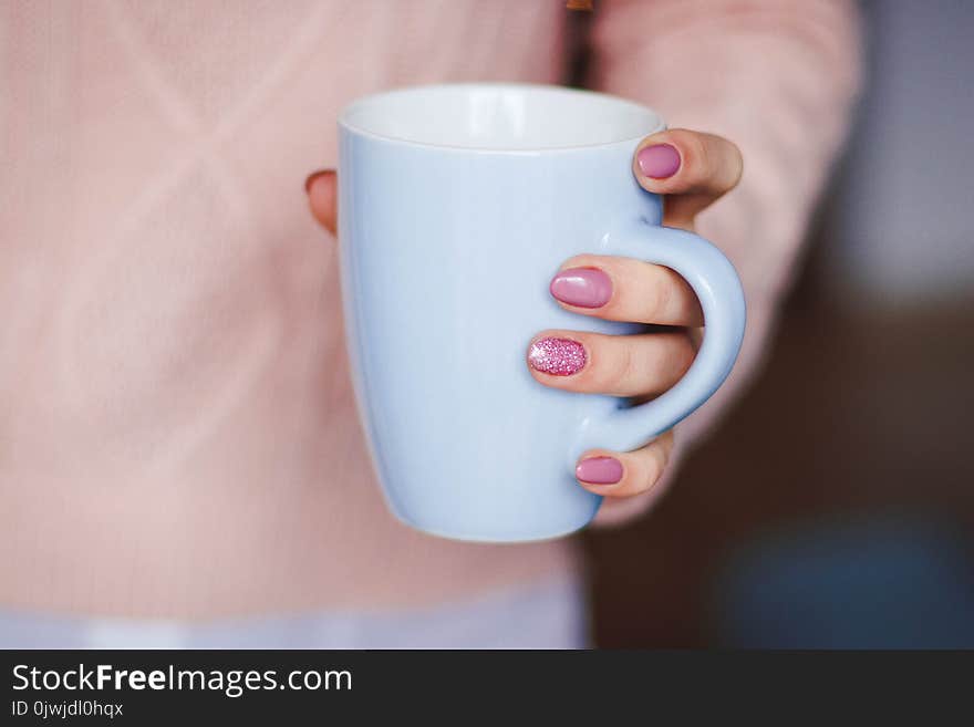 Person Holding White Ceramic Mug