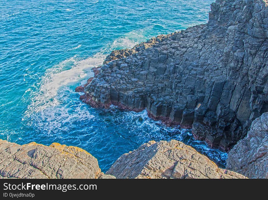 Grey Rock Formation Near Water