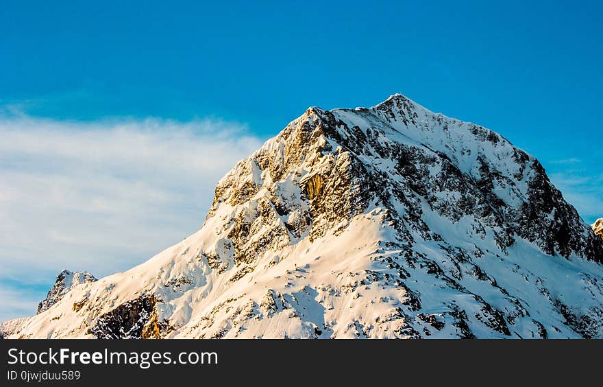 Snow Covered Mountain Under Clear Blue Sky