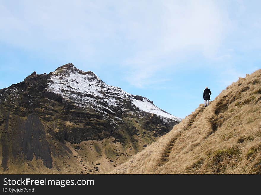 Person Climb on Mountain