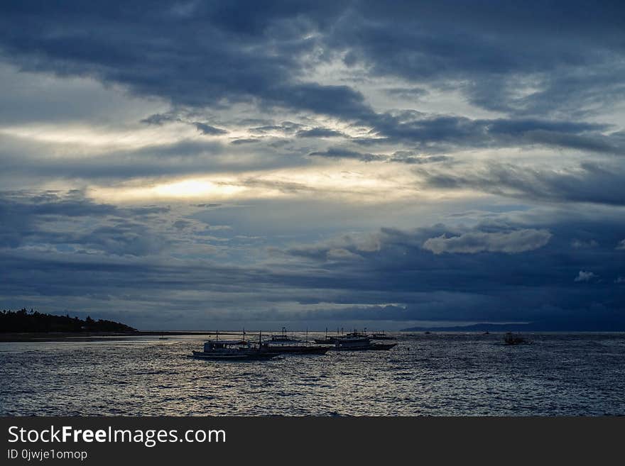 Ships on Body of Water during Cloudy Daytime