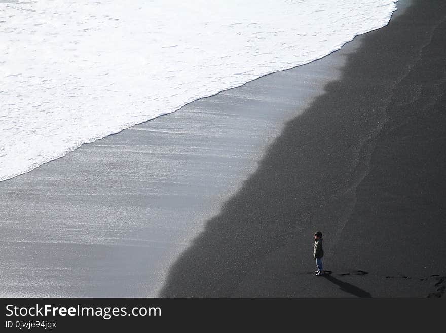 Child Standing on the Seashore