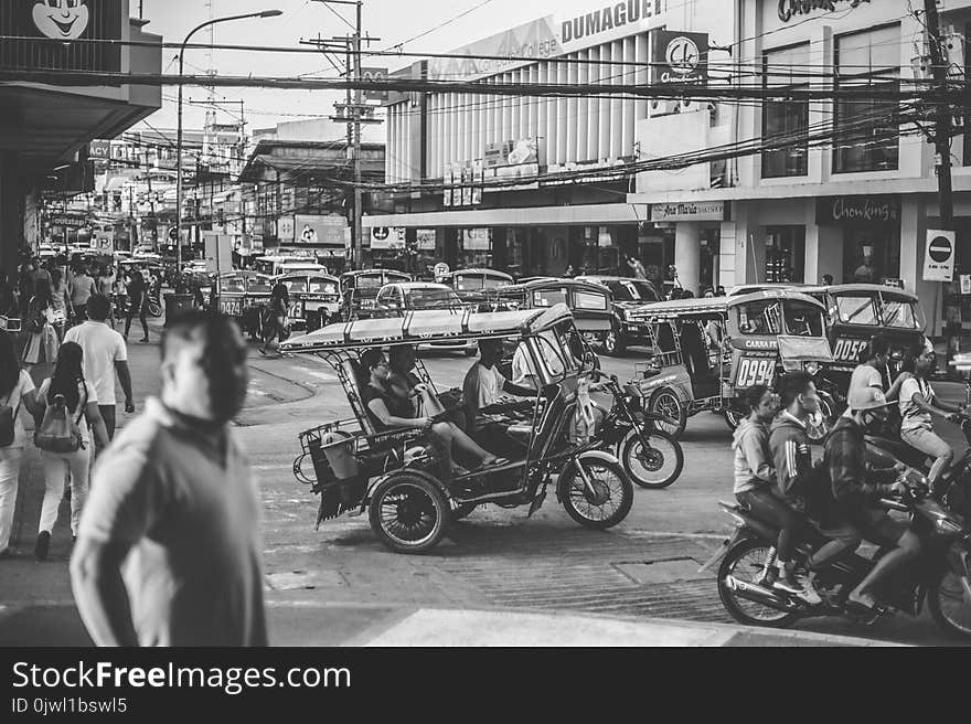 Grayscale Photo of Motorcycles and People