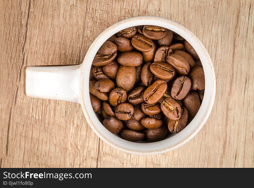 Roasted Coffee Beans Inside White Ceramic Mug