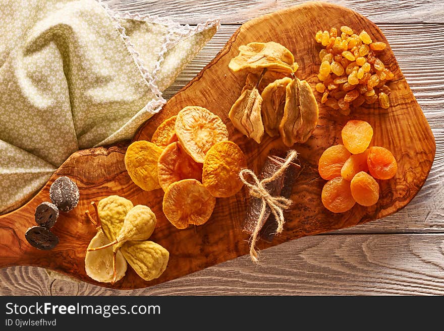 Dried fruits on vintage rustic wooden background. Dried fruits on vintage rustic wooden background