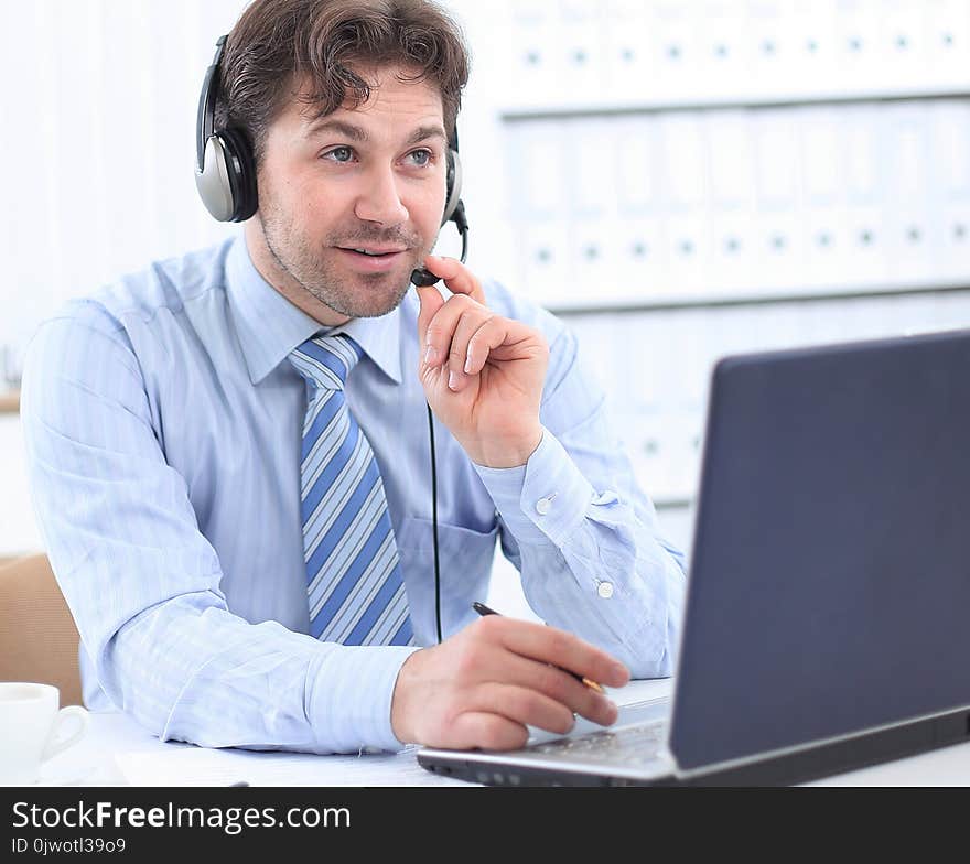 Happy Young Man Working At Callcenter, Using Headset