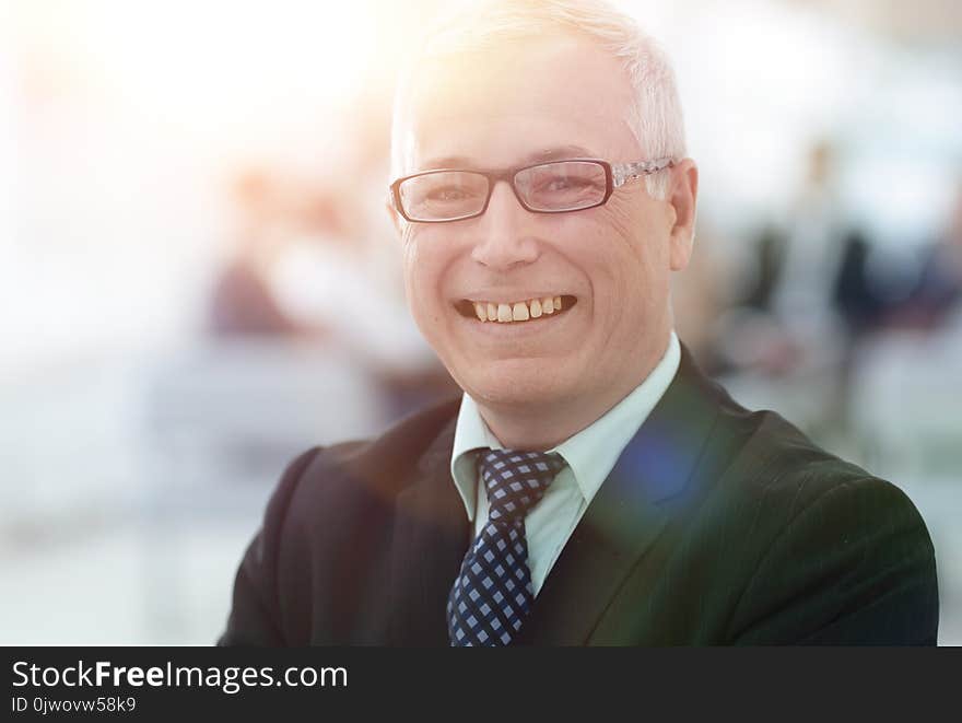 Close up portrait of senior businessman in office. photo with copy space.