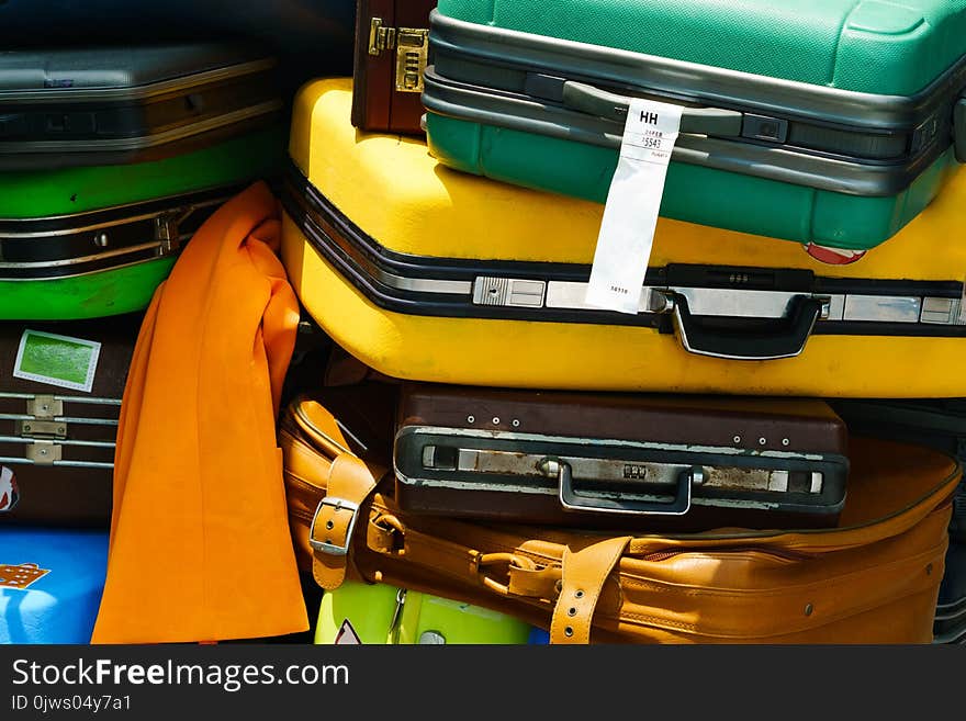 Close up of pile of old travel suitcases luggages stacked for tr