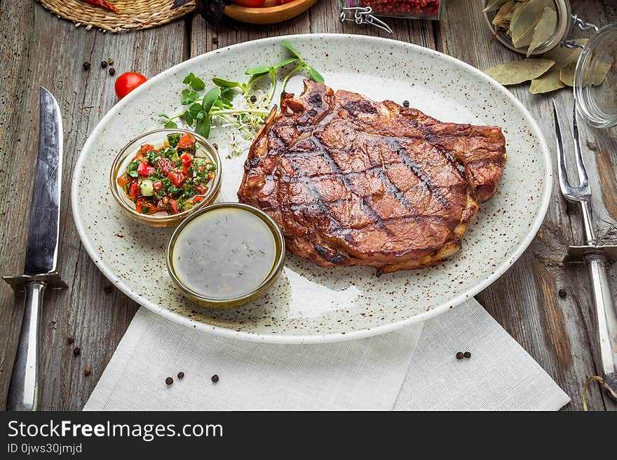 Tenderloin steak on plate with sauce