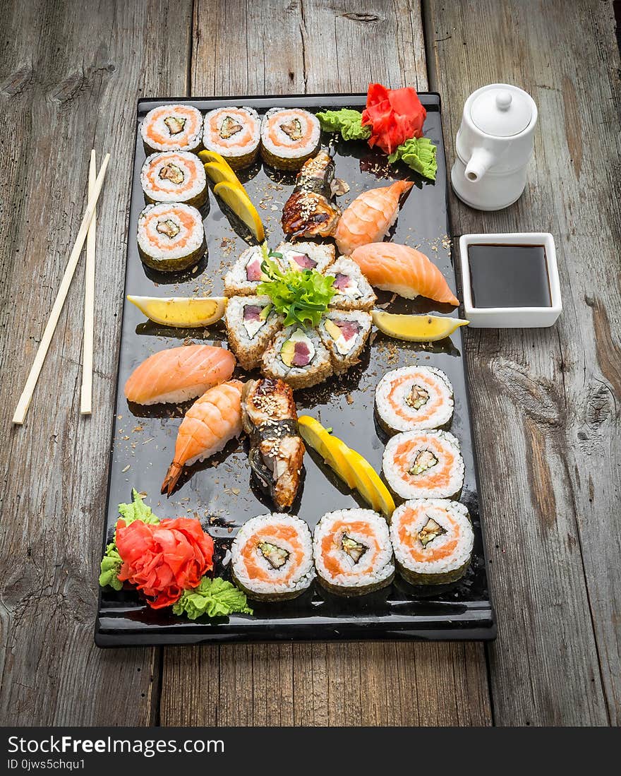 Rainbow Sushi Roll with salmon, eel, tuna, avocado, royal prawn, cream cheese Philadelphia, caviar tobica, chuka. Sushi menu. Japa