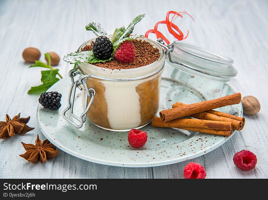 Traditional Italian dessert tiramisu in a glass.