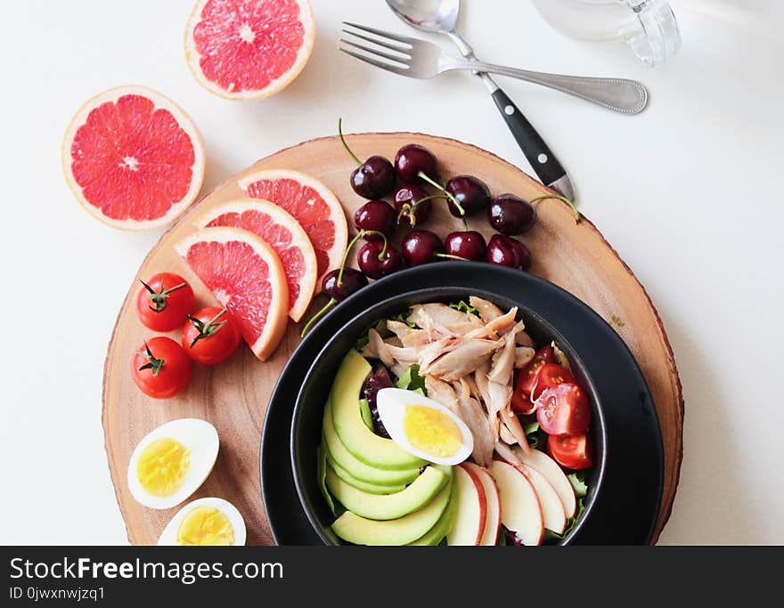 Bowl of Vegetable Salad and Fruits