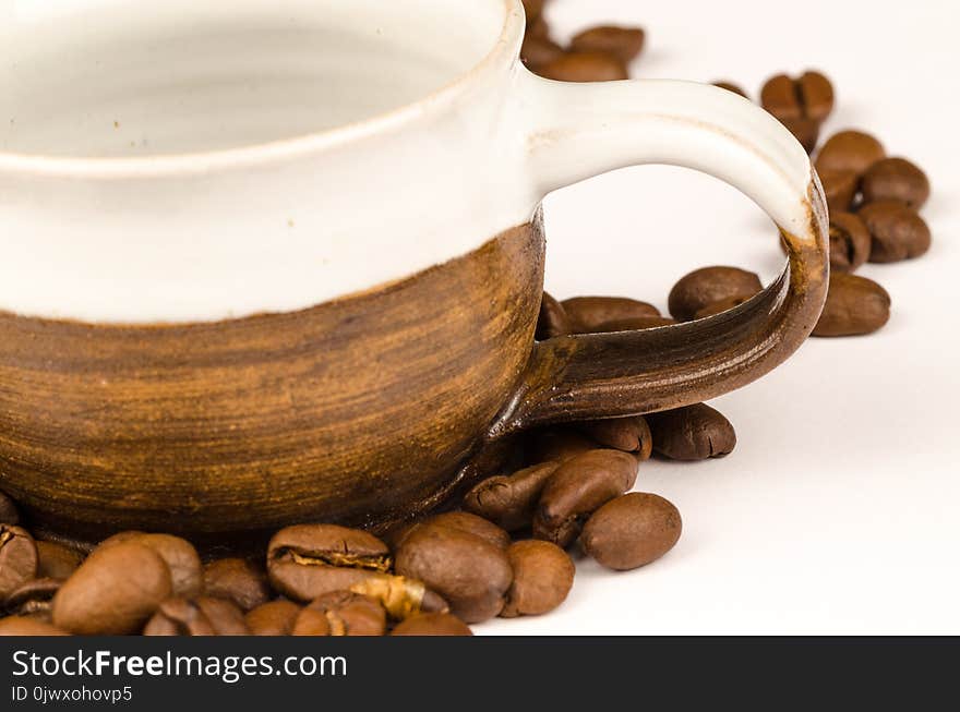 Brown Nuts and Brown Ceramic Tea Cup