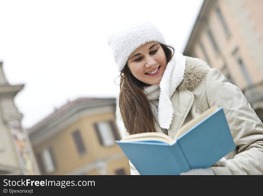 Woman in Gray Coat and White Cap