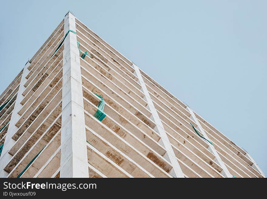 Low Angle Photography of Beige Concrete Building