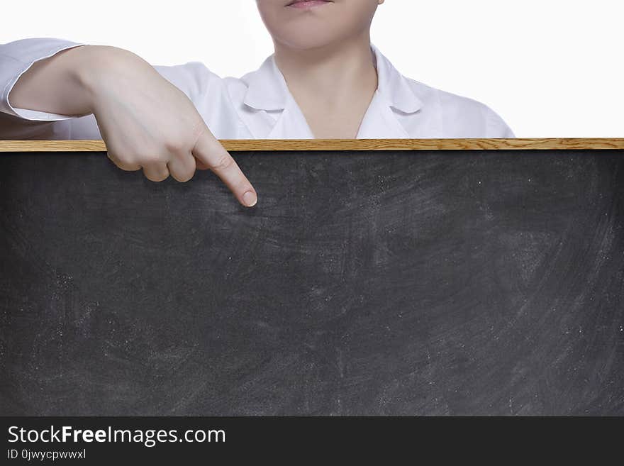 A female doctor points a finger at the blackboard. A female doctor points a finger at the blackboard