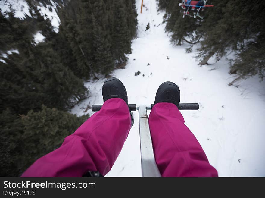 legs on cable car over the mountains in ski resort