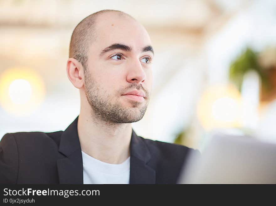 Close-up of young businessman working at cafe. Close-up of young businessman working at cafe