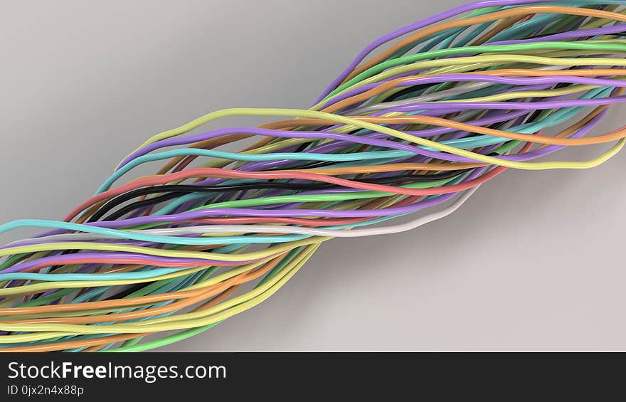 Twisted multicolored cables and wires on white surface