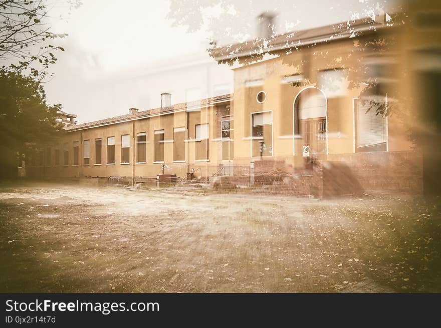 External facade of old and abandoned devastated school in double exposition composition, ready for renovation. External facade of old and abandoned devastated school in double exposition composition, ready for renovation