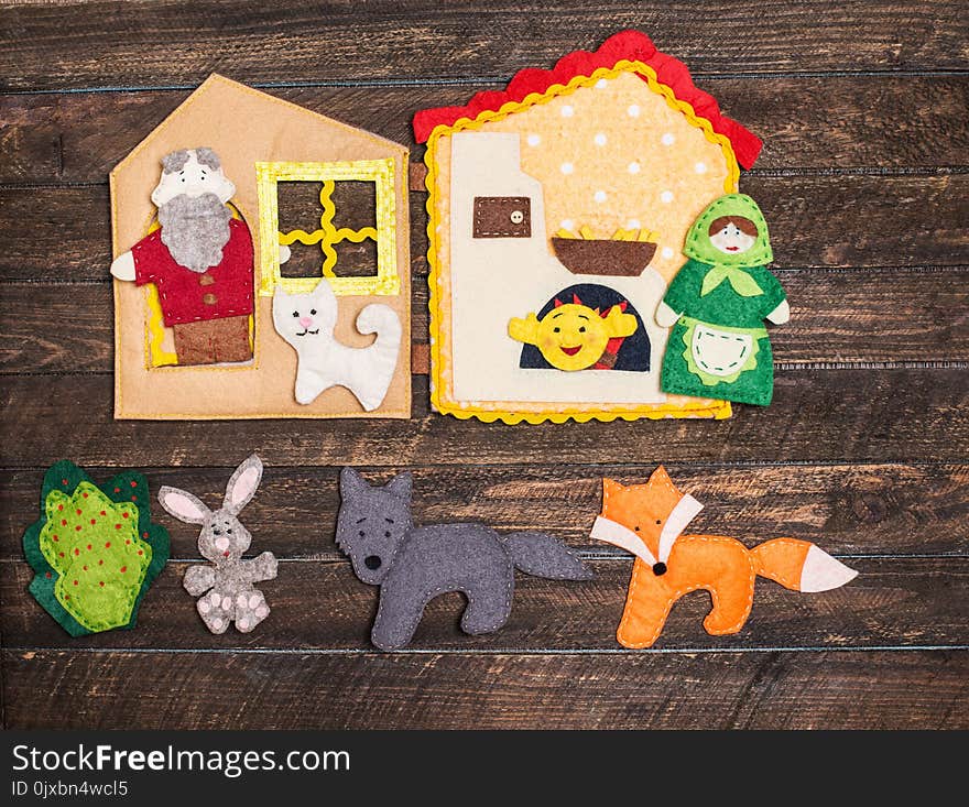 Felt toys story fairy tale. Handmade felt toys over wooden rustic background.