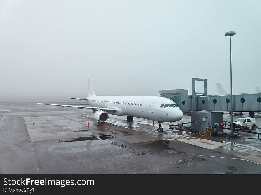 Plane at the airport in fog. Plane at the airport in fog