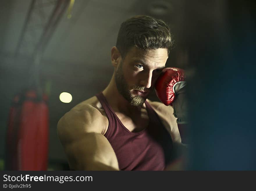 Close-up Photography of Man Wearing Boxing Gloves