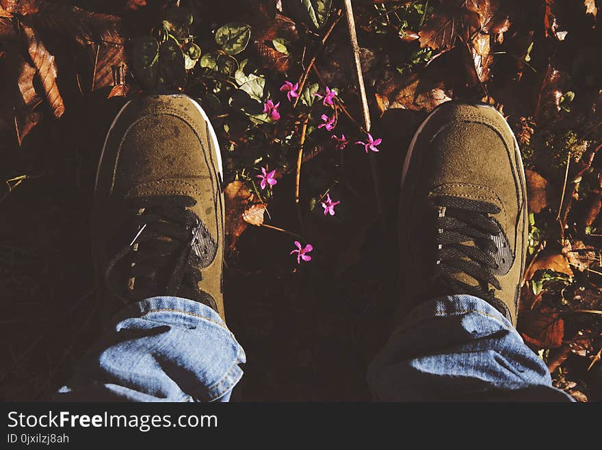 Person Wearing Pair Of Brown Suede Sneakers