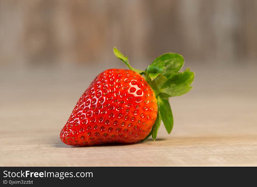 Strawberry Fruit on Brown Wooden Surface