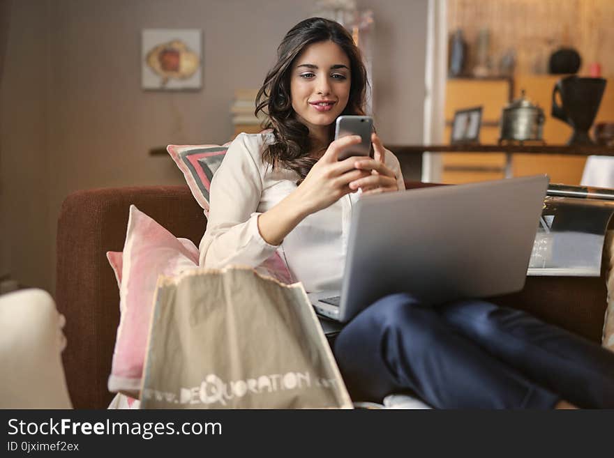 Photo of a Woman Using Her Smartphone