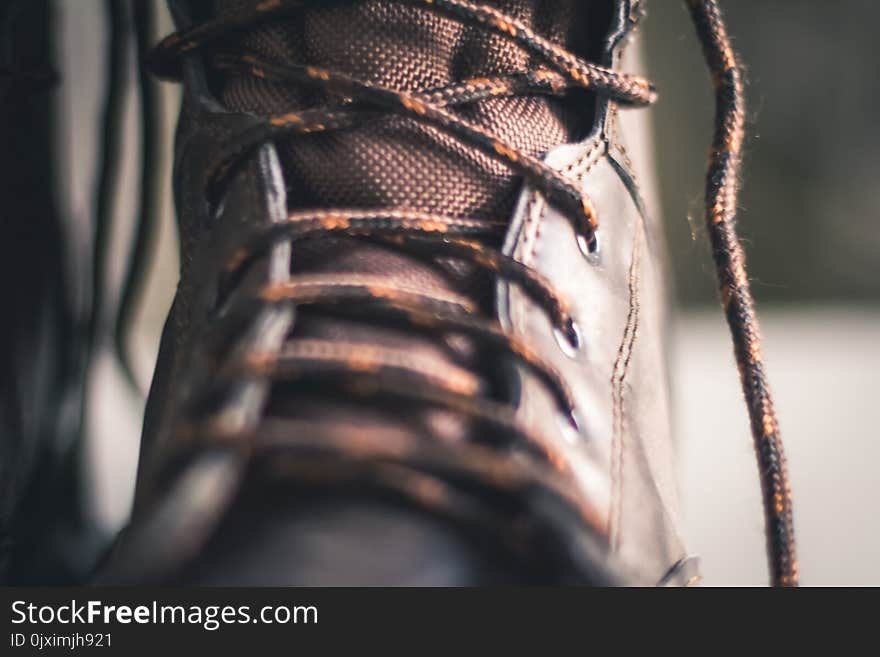 Closeup Photo of Brown Lace-up Boot