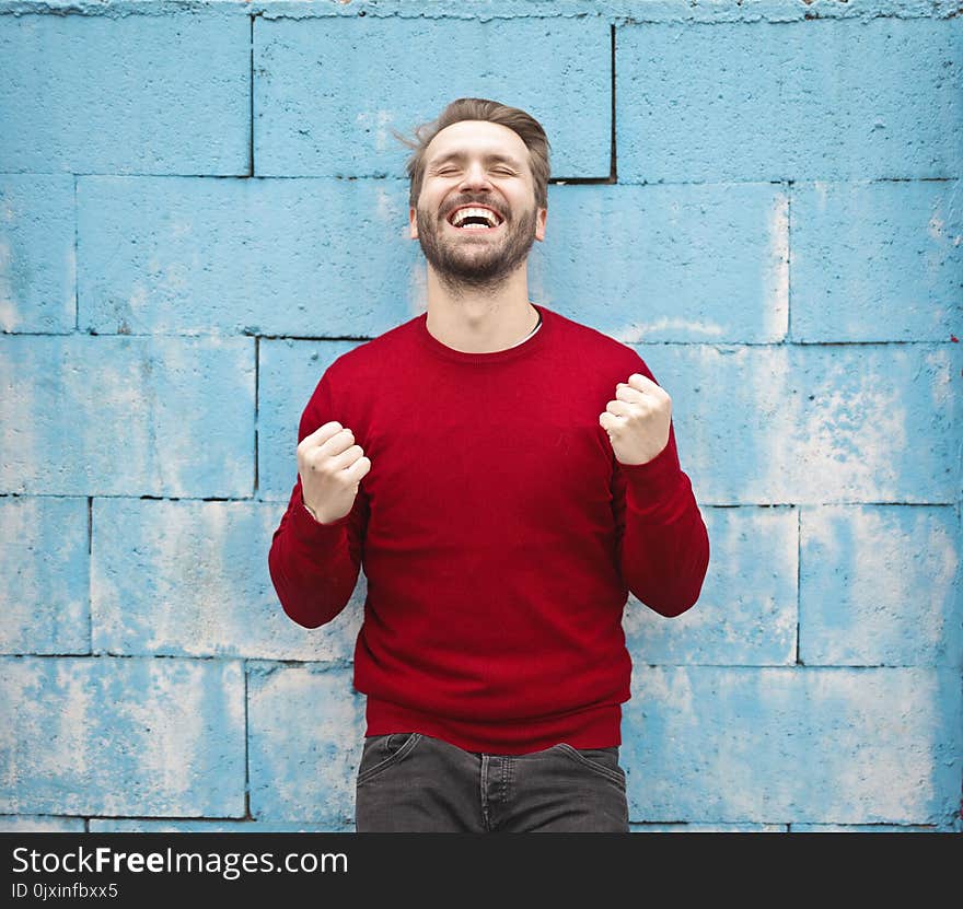 Man in Red Crew-neck Sweatshirt Photography