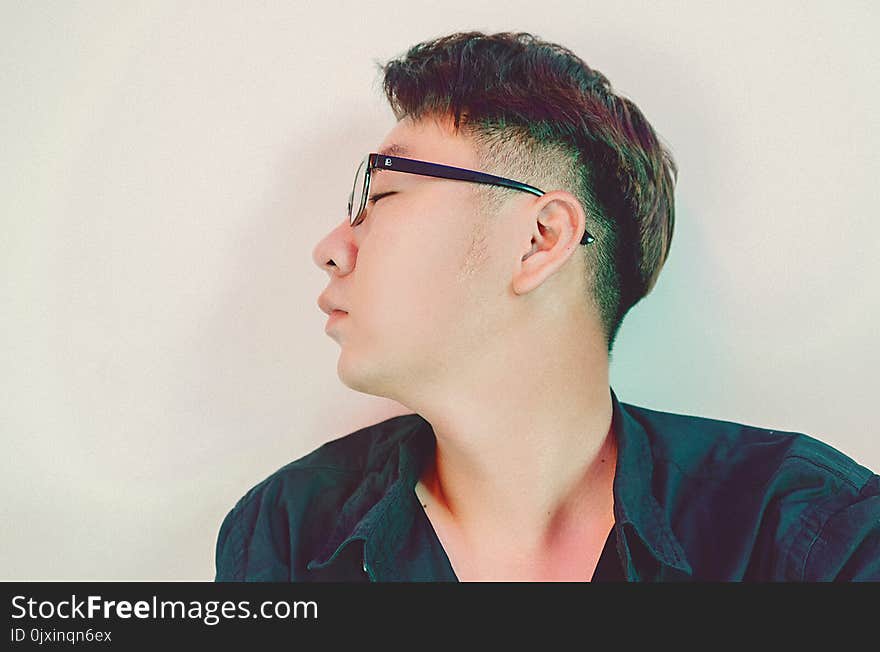 Man in Black Collared Shirt With Black Frame Eyeglasses