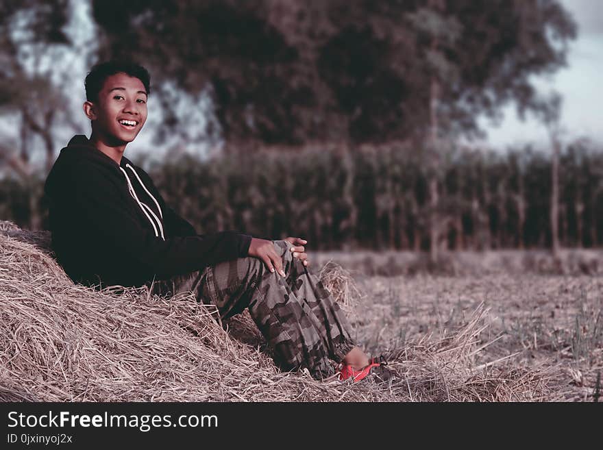 Shallow Focus Photography of Man in Black Jacket and Camouflage Pants