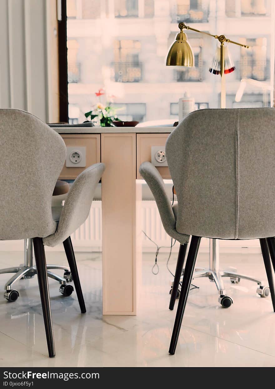 Gray Armchairs Beside White Wooden Desk