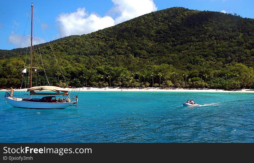 Group of People on White Speed Boat