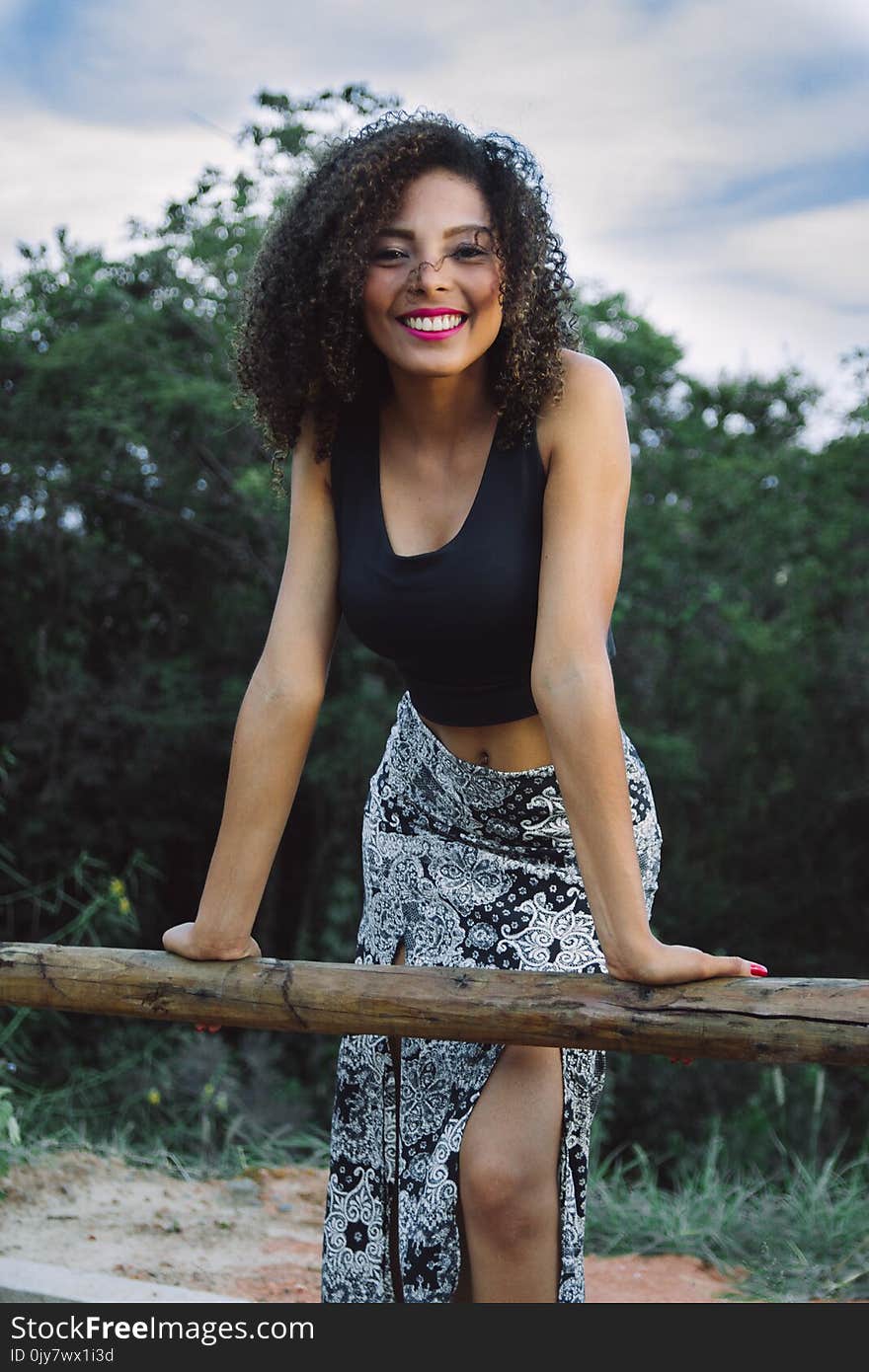 Woman Wearing Black Tank Tops and Gray Floral Asymmetrical Long Skirt